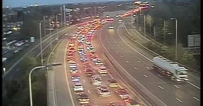 Traffic at standstill near Trafford Center after trailer overturns on M60
